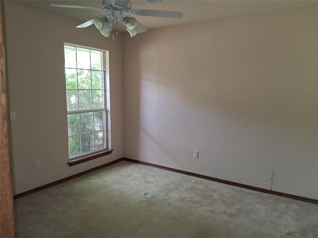 824 SE 38th St, Moore, OK 73129 - unfurnished room featuring carpet, plenty of natural light, baseboards, and ceiling fan
