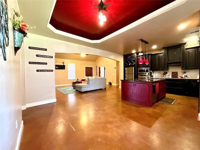 16175 Silver Run Dr, Choctaw, OK 73020 - kitchen with fridge, concrete floors, decorative backsplash, baseboards, and arched walkways