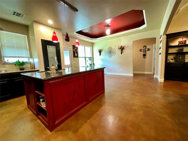 16175 Silver Run Dr, Choctaw, OK 73020 - kitchen featuring open shelves, a center island, a raised ceiling, baseboards, and dark stone countertops