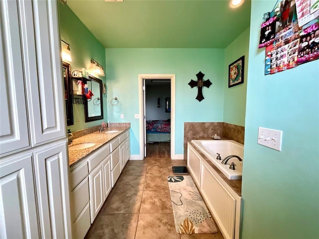 16175 Silver Run Dr, Choctaw, OK 73020 - bathroom with a garden tub, double vanity, tile patterned flooring, and baseboards
