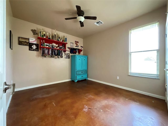 16175 Silver Run Dr, Choctaw, OK 73020 - spare room featuring concrete floors, ceiling fan, and baseboards