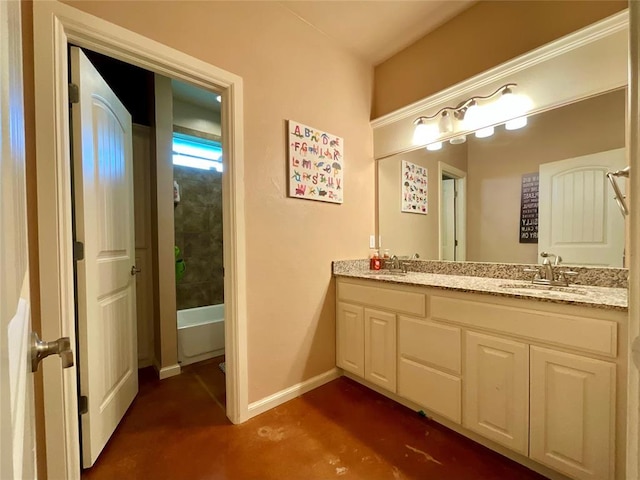 16175 Silver Run Dr, Choctaw, OK 73020 - bathroom featuring double vanity, baseboards, a bathtub, and concrete flooring