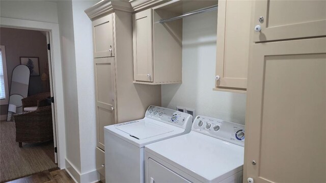 25 Firefly Ln, Eufaula, OK 74432 - washroom with washing machine and clothes dryer, cabinet space, dark wood finished floors, and baseboards