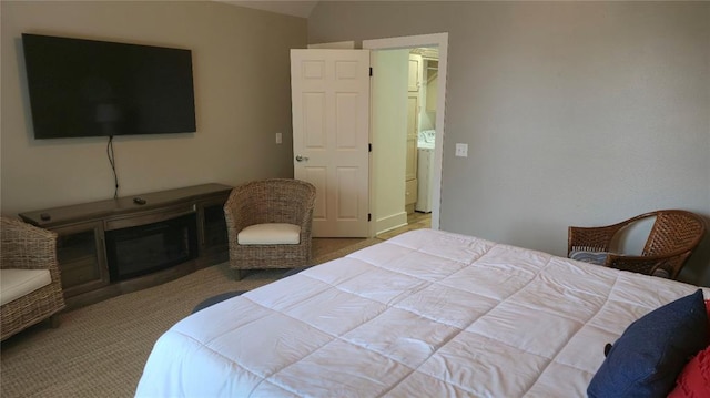 25 Firefly Ln, Eufaula, OK 74432 - carpeted bedroom featuring washer / clothes dryer and lofted ceiling