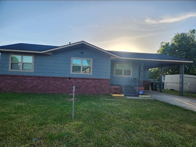 2421 N Prospect Ave, Oklahoma City, OK 73111 - ranch-style house with brick siding, concrete driveway, an attached carport, and a shingled roof