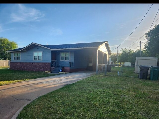 2421 N Prospect Ave, Oklahoma City, OK 73111 - ranch-style house featuring concrete driveway, brick siding, and a carport