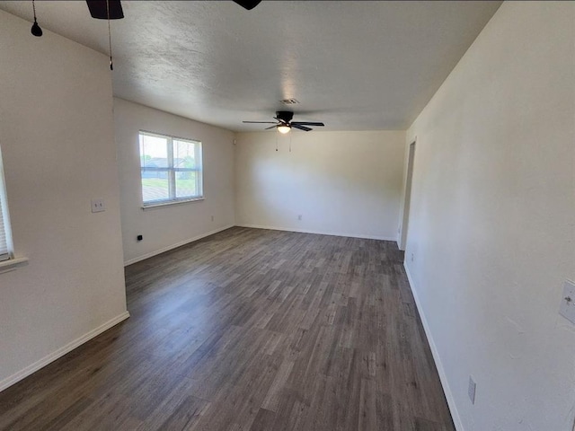 2421 N Prospect Ave, Oklahoma City, OK 73111 - empty room with a ceiling fan, dark wood-style flooring, and baseboards