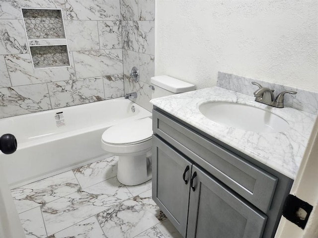 2421 N Prospect Ave, Oklahoma City, OK 73111 - bathroom with toilet, vanity, marble look tiles, a textured wall, and shower / tub combination