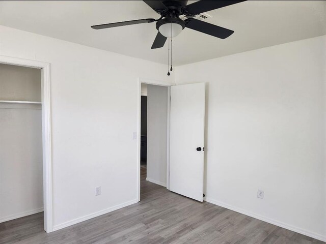 2421 N Prospect Ave, Oklahoma City, OK 73111 - unfurnished bedroom with wood finished floors, a closet, baseboards, and ceiling fan
