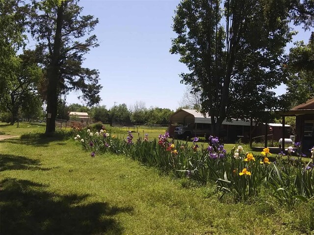 218 N 4150th Rd, Antlers, OK 74523 - view of grassy yard featuring a carport