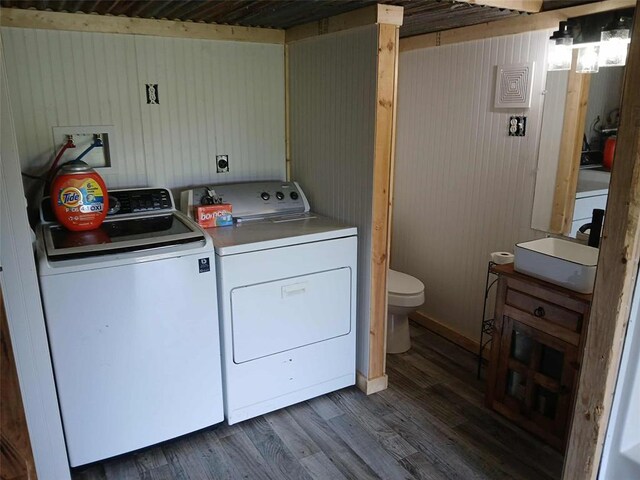 218 N 4150th Rd, Antlers, OK 74523 - laundry area with separate washer and dryer, dark wood-style floors, and wooden walls