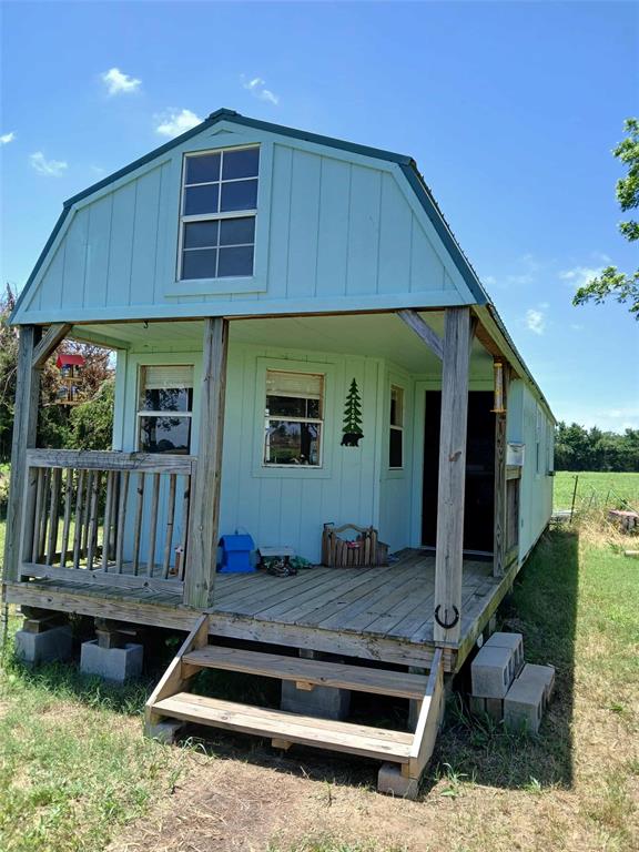 218 N 4150th Rd, Antlers, OK 74523 - rear view of house featuring board and batten siding and a deck