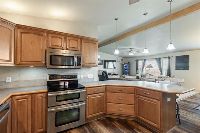 22950 E 1130th Rd, Bessie, OK 73622 - kitchen with appliances with stainless steel finishes, a peninsula, brown cabinets, and beamed ceiling
