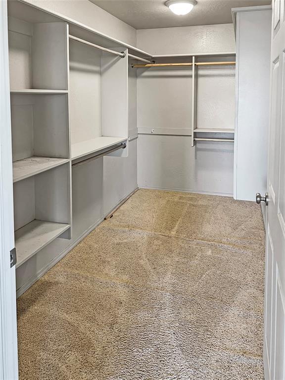 22950 E 1130th Rd, Bessie, OK 73622 - walk in closet featuring carpet