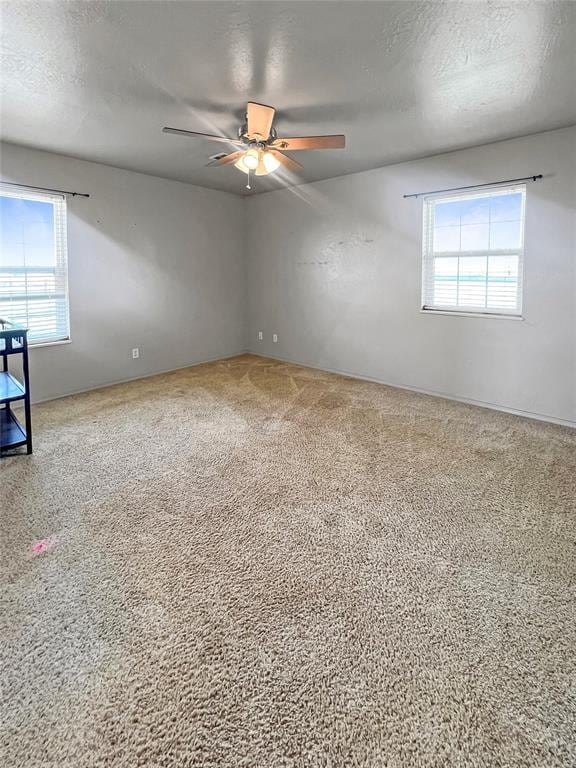 22950 E 1130th Rd, Bessie, OK 73622 - empty room featuring a ceiling fan, carpet, and a textured ceiling