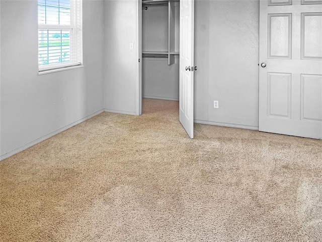 22950 E 1130th Rd, Bessie, OK 73622 - unfurnished bedroom featuring carpet flooring, a closet, and a spacious closet