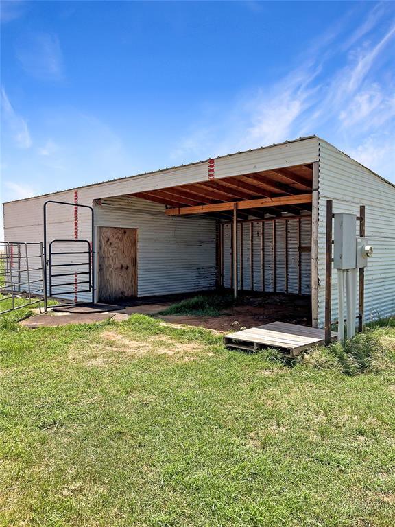 22950 E 1130th Rd, Bessie, OK 73622 - view of pole building with a carport and a yard