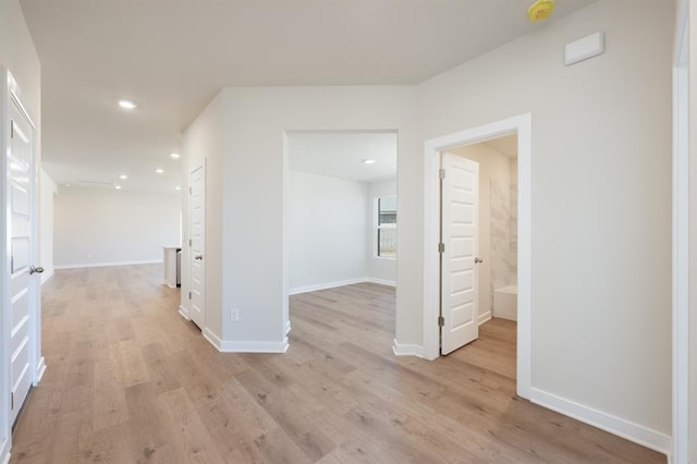 10324 NW 28th St, Yukon, OK 73099 - hallway featuring light wood-type flooring, recessed lighting, and baseboards