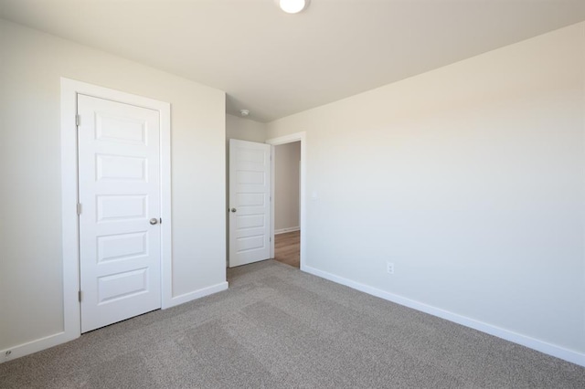 10324 NW 28th St, Yukon, OK 73099 - unfurnished bedroom featuring carpet floors and baseboards