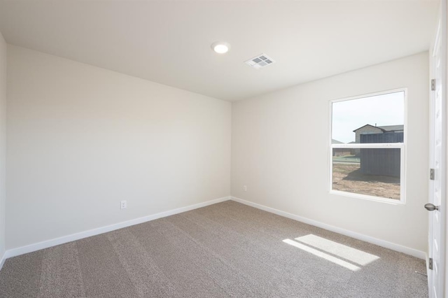 10324 NW 28th St, Yukon, OK 73099 - spare room featuring carpet flooring and baseboards
