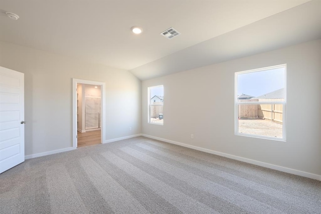 10324 NW 28th St, Yukon, OK 73099 - unfurnished bedroom with carpet floors, baseboards, lofted ceiling, and recessed lighting