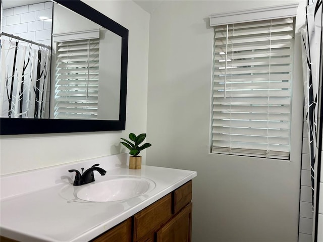 bathroom with vanity and a shower with shower curtain