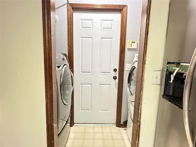 clothes washing area featuring washer / dryer