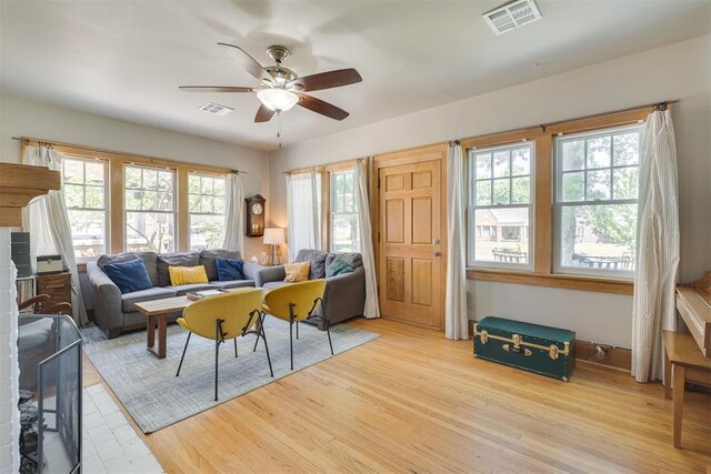 2534 NW 19th St, Oklahoma City, OK 73107 - living room featuring plenty of natural light, a ceiling fan, and wood finished floors