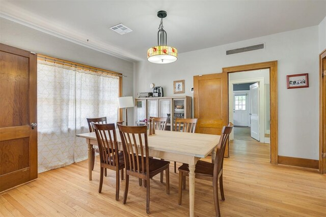 2534 NW 19th St, Oklahoma City, OK 73107 - dining area featuring light wood-style flooring and baseboards