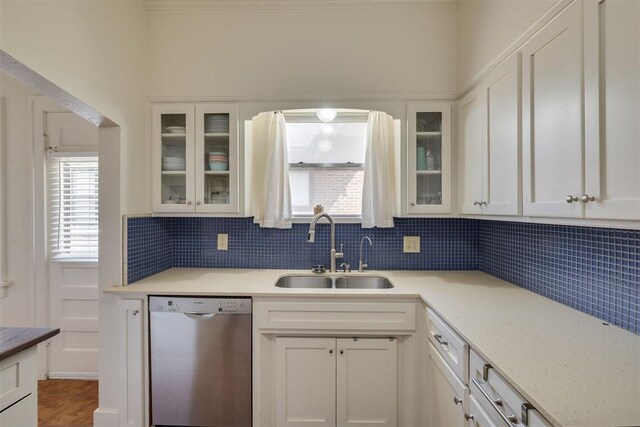 2534 NW 19th St, Oklahoma City, OK 73107 - kitchen with dishwasher, a sink, tasteful backsplash, and light countertops