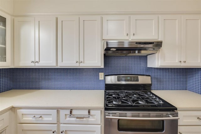 2534 NW 19th St, Oklahoma City, OK 73107 - kitchen featuring stainless steel range with gas cooktop, ventilation hood, tasteful backsplash, and white cabinets
