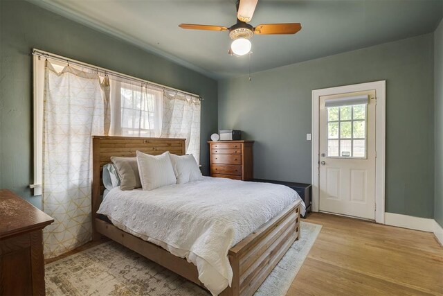2534 NW 19th St, Oklahoma City, OK 73107 - bedroom with light wood-style flooring, a ceiling fan, and baseboards