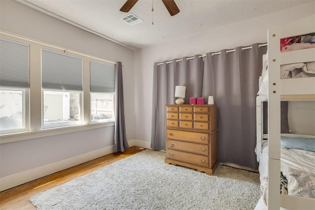 2534 NW 19th St, Oklahoma City, OK 73107 - bedroom featuring wood finished floors, baseboards, and a ceiling fan