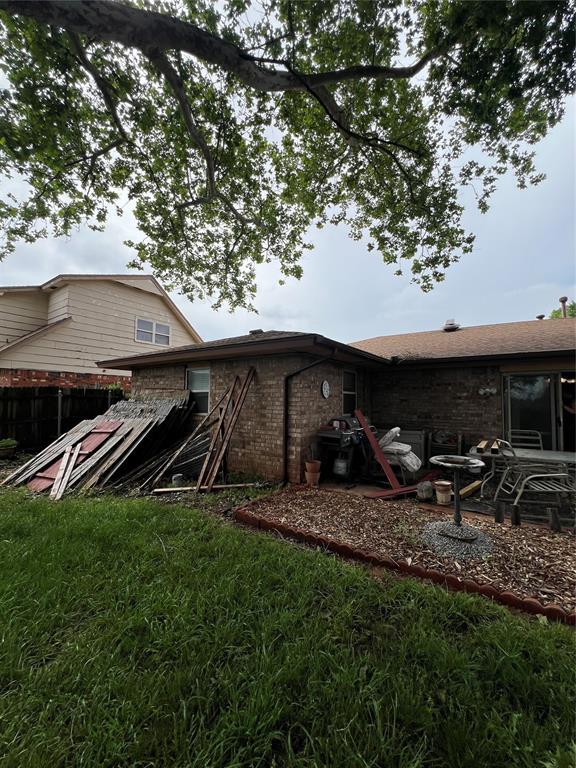4125 Overland Dr, Del City, OK 73115 - rear view of property with brick siding and fence
