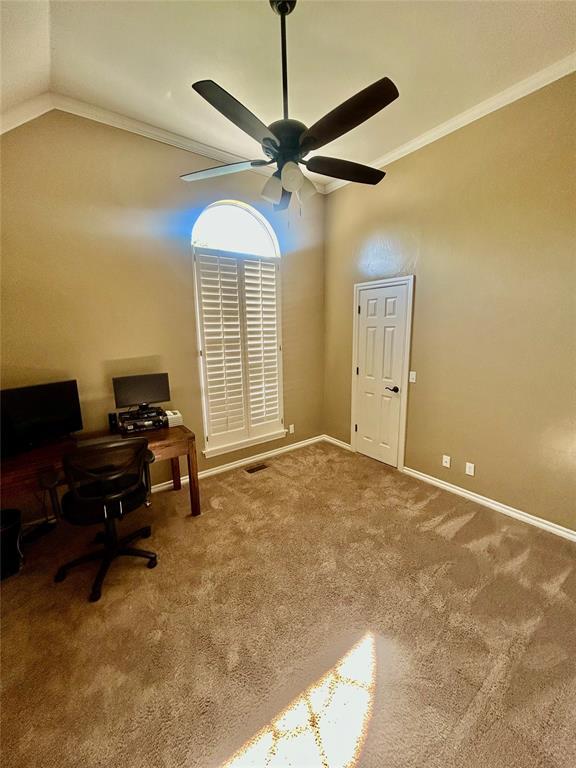 9817 Horseshoe Rd, Oklahoma City, OK 73162 - home office featuring carpet floors, ceiling fan, lofted ceiling, ornamental molding, and baseboards