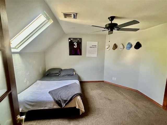 9817 Horseshoe Rd, Oklahoma City, OK 73162 - carpeted bedroom with vaulted ceiling, ceiling fan, and a skylight