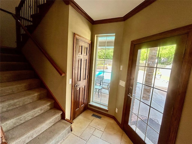 9817 Horseshoe Rd, Oklahoma City, OK 73162 - entryway featuring ornamental molding, stairs, stone tile floors, and baseboards
