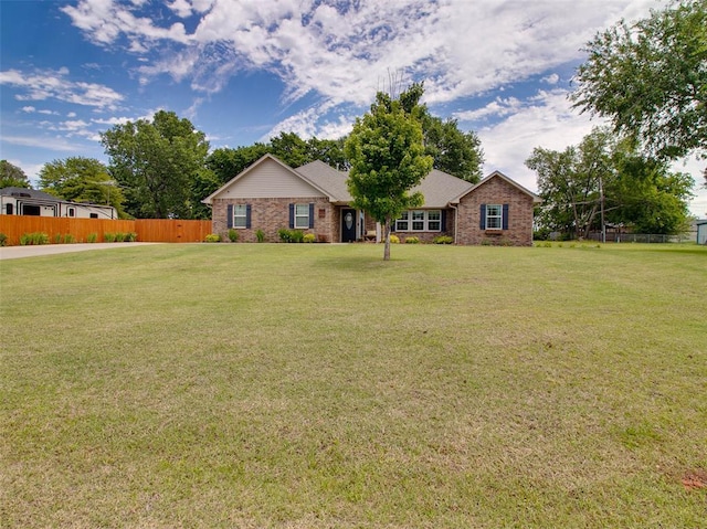 1015 N 3rd Ave, Stroud, OK 74079 - ranch-style house featuring brick siding
