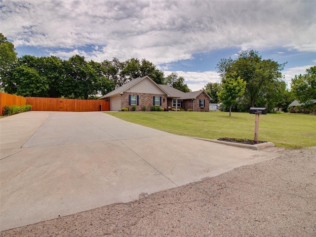 1015 N 3rd Ave, Stroud, OK 74079 - single story home with concrete driveway and a garage