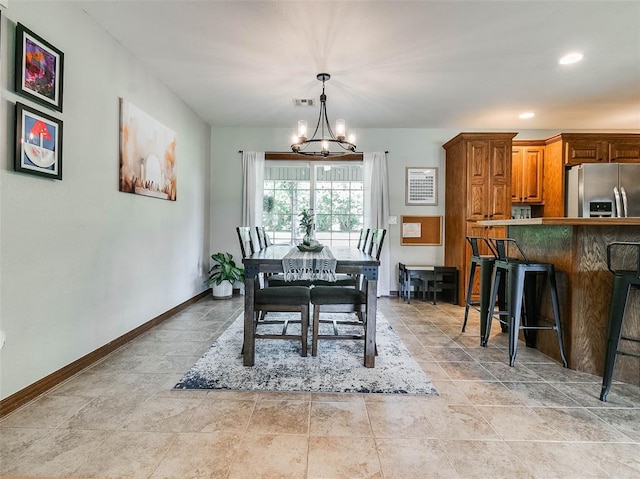1015 N 3rd Ave, Stroud, OK 74079 - dining space featuring a chandelier, baseboards, and recessed lighting