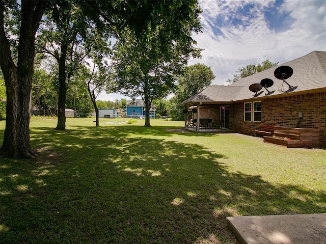 1015 N 3rd Ave, Stroud, OK 74079 - view of grassy yard with a patio area