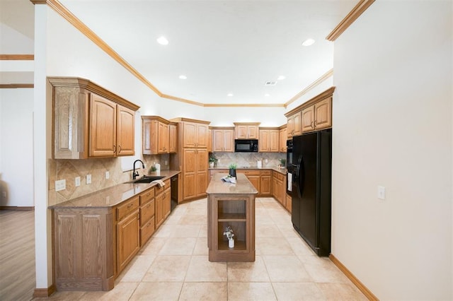 10681 NW 107th St, Yukon, OK 73099 - kitchen featuring black appliances, a sink, crown molding, tasteful backsplash, and light stone countertops