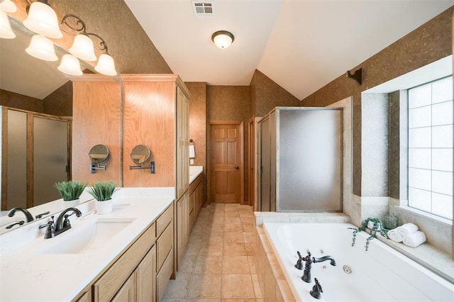 10681 NW 107th St, Yukon, OK 73099 - bathroom featuring a stall shower, a jetted tub, double vanity, tile patterned flooring, and vaulted ceiling