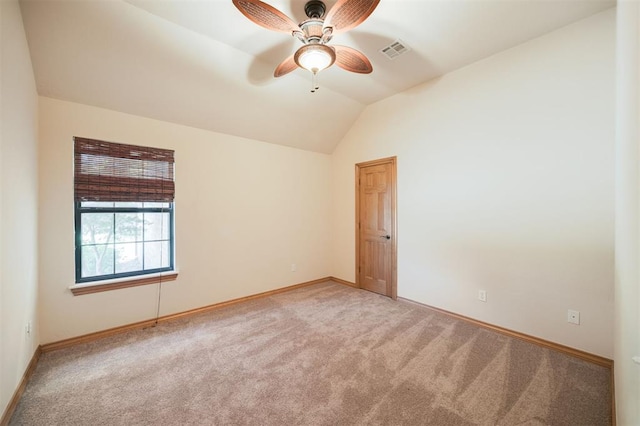 10681 NW 107th St, Yukon, OK 73099 - spare room with light colored carpet, baseboards, and lofted ceiling