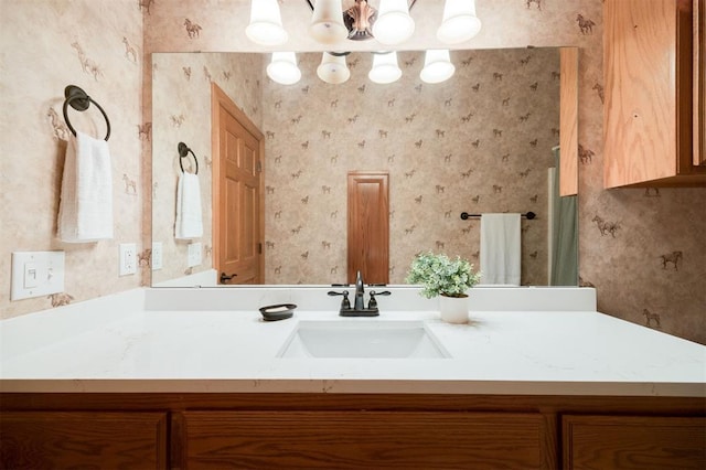 10681 NW 107th St, Yukon, OK 73099 - bathroom with wallpapered walls and vanity