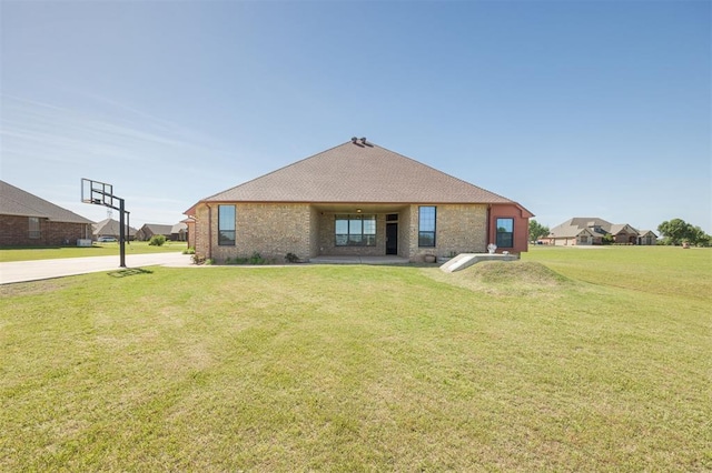 10681 NW 107th St, Yukon, OK 73099 - view of front facade with a front lawn and brick siding