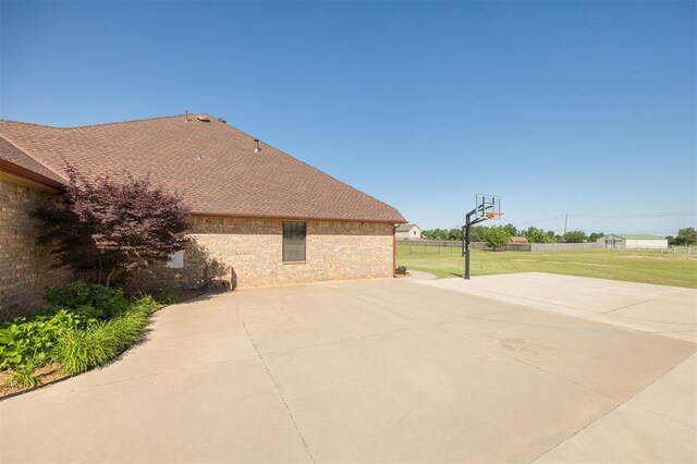 10681 NW 107th St, Yukon, OK 73099 - view of patio / terrace featuring basketball hoop