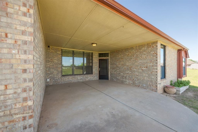 10681 NW 107th St, Yukon, OK 73099 - view of patio / terrace with a carport
