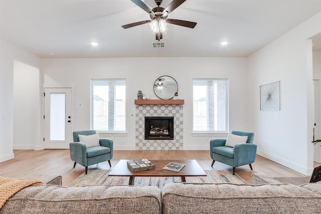 11616 NW 106th St, Yukon, OK 73099 - living area with healthy amount of natural light, wood finished floors, a fireplace, and recessed lighting