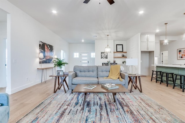 11616 NW 106th St, Yukon, OK 73099 - living room featuring light wood-style floors, ceiling fan, recessed lighting, and baseboards